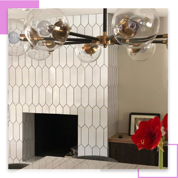 Modern fireplace with hex tile and chandelier
