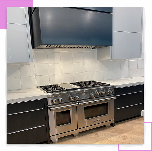 Stainless steel double oven range in kitchen