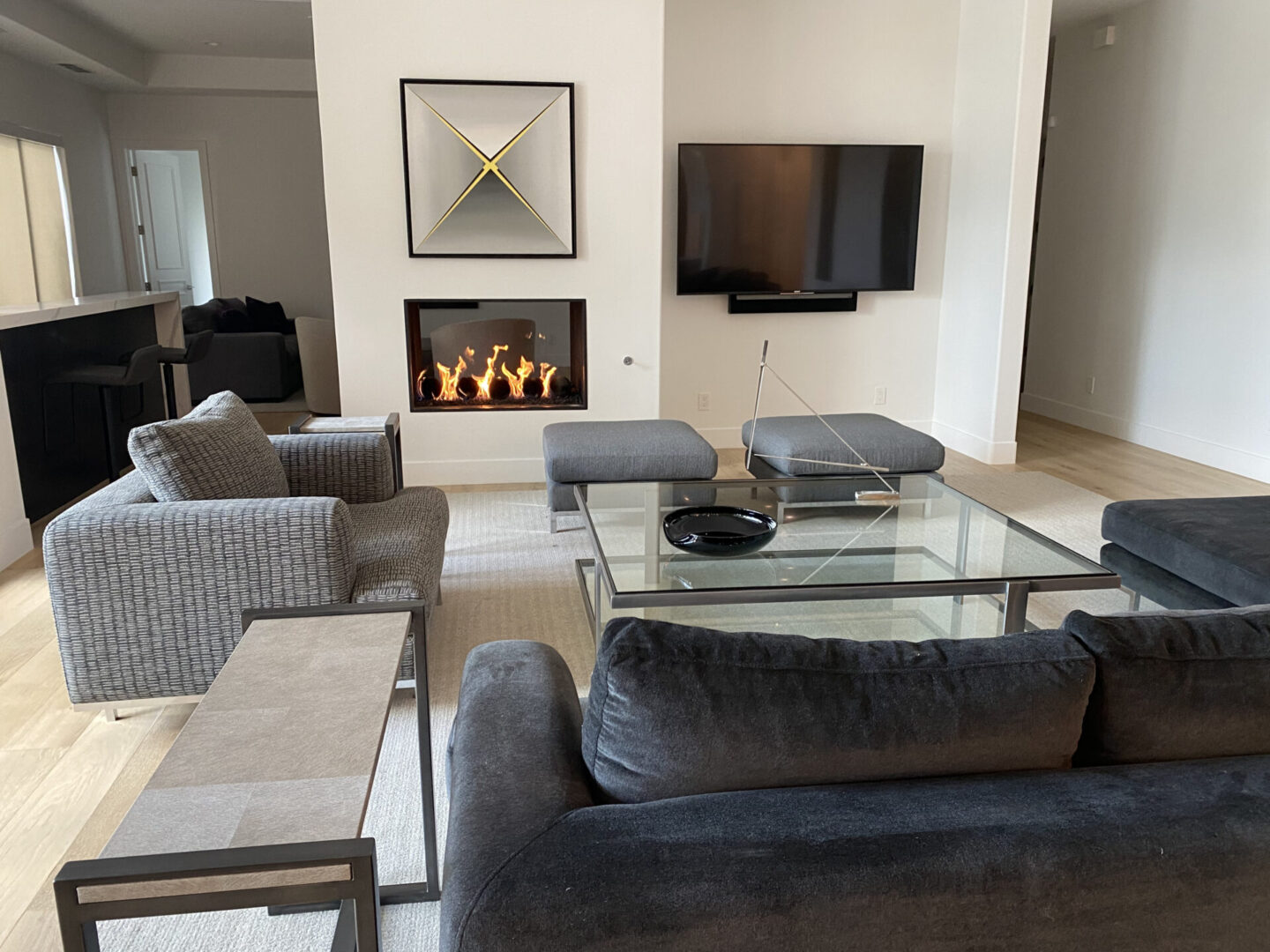 Gray sofas around glass coffee table