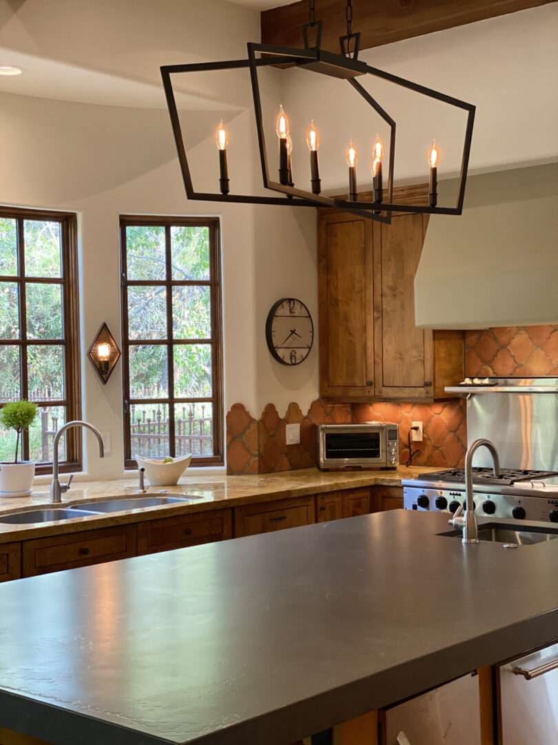 Rustic kitchen with island and chandelier