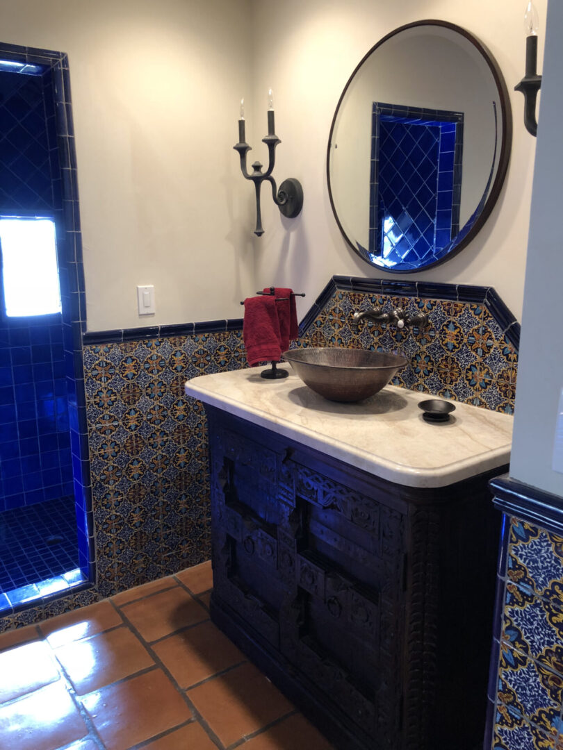 Bathroom vanity with round mirror and sink