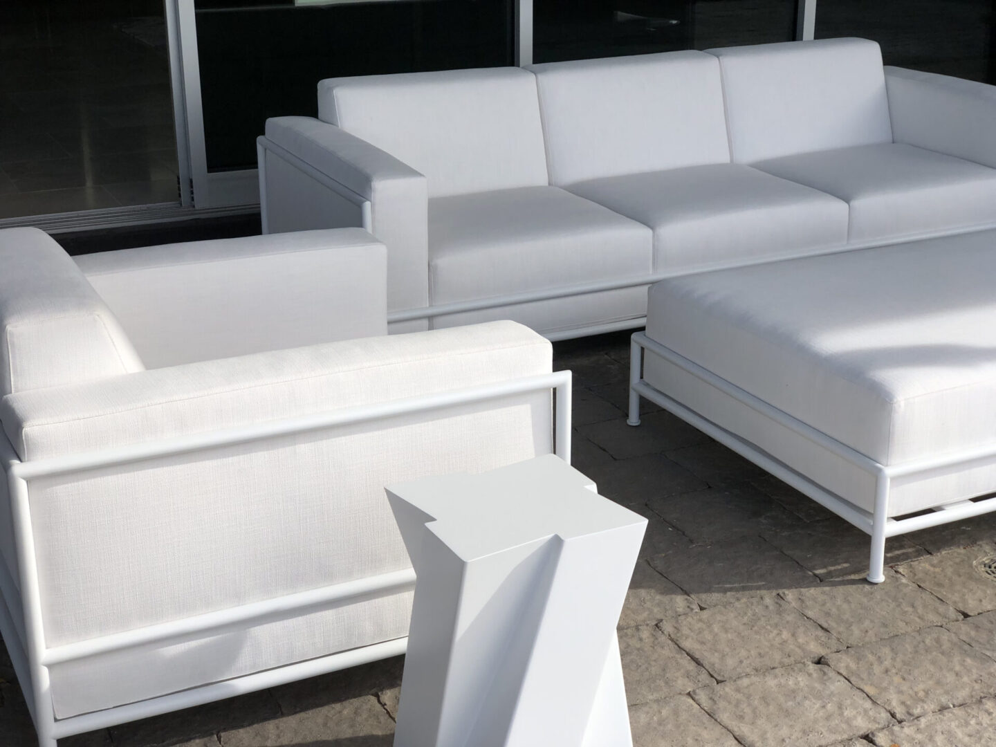 White modern outdoor sofas and ottoman