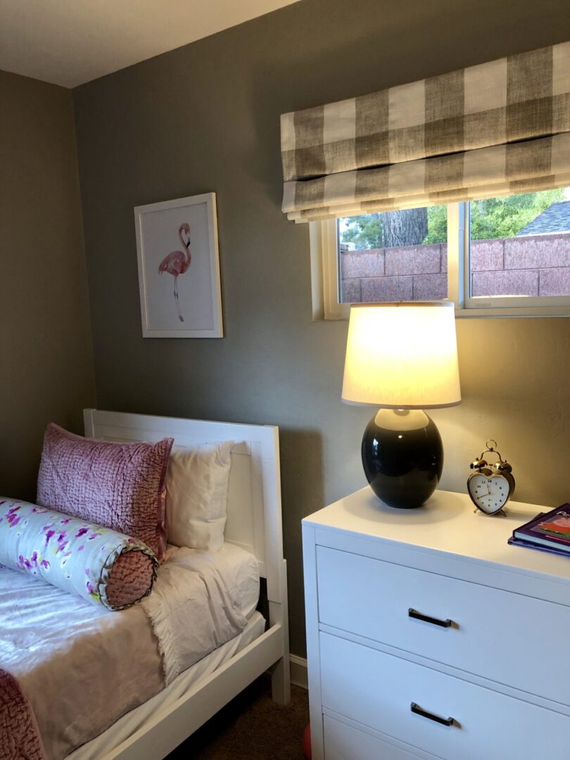 Cozy bedroom corner with bed and lamp